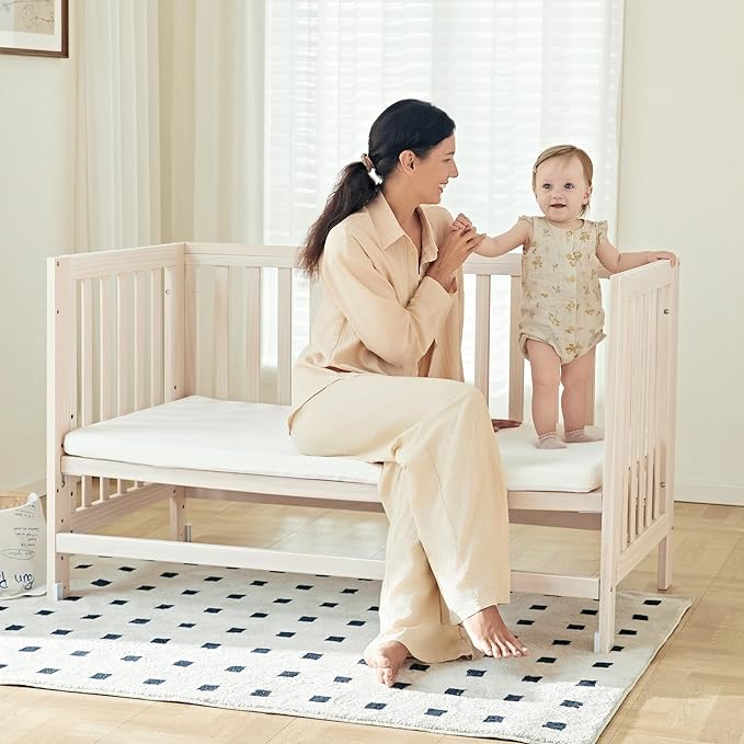 EvoNest Baby Crib, 11 in 1 Convertible Mini Crib with Wheels, 100% New Zealand Wood Growing Bed, 4 Adjustable Mattress Height,Washed Natural