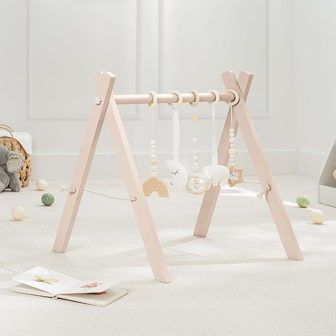 Comfy Cubs Wooden Baby Play Gym - Natural Finish Pinewood Baby Activity Gym with 5 Sensory Hanging Toys - Easy No-Tool Assembly, Safe and Durable for Infant Motor and Visual Development - Blush