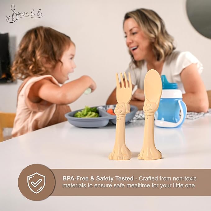 Made in USA Spoon la la Toddler Utensils Set (2 Pack) & Board Book - Spoon & Fork for Kids, Self-Standing 3D Ergonomic Cat & Dog Handles, BPA-free, Dishwasher Safe Baby Silverware (Yellow)